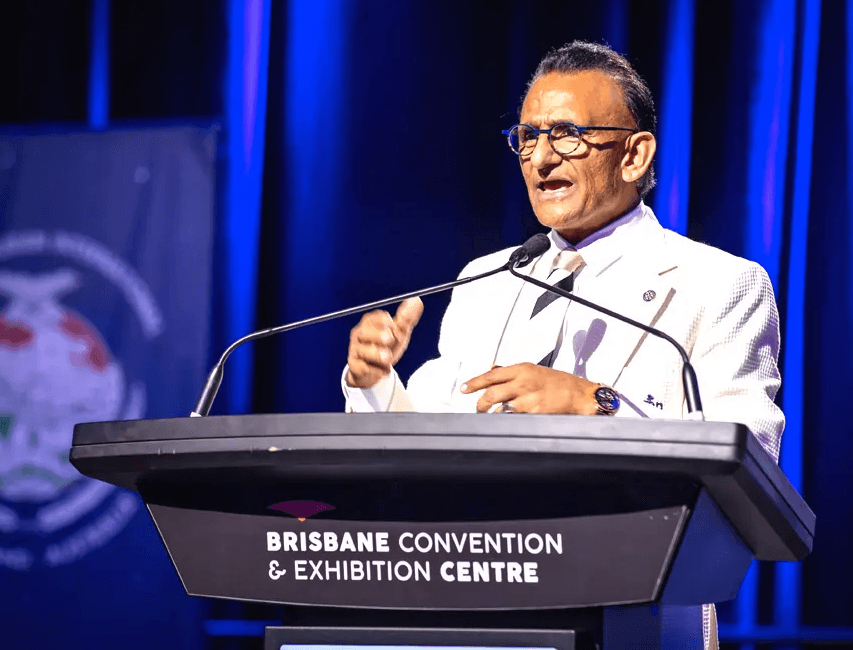 Zaffar Khan speaking on stage at the Brisbane Convention & Exhibition Centre